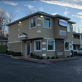 exterior building of the Travel Inn & Suites